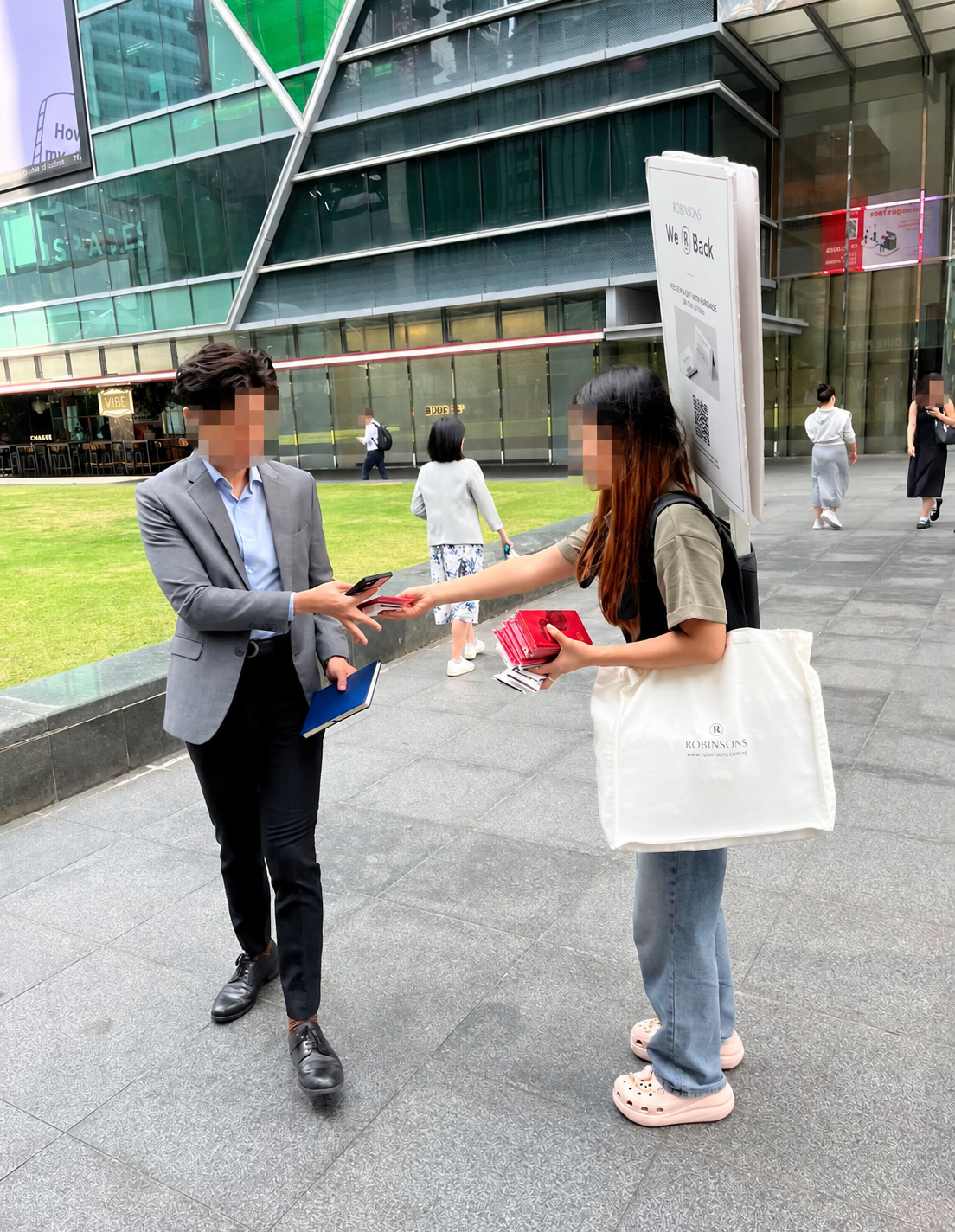 Street flyer distribution with a backpack advertising board in Singapore